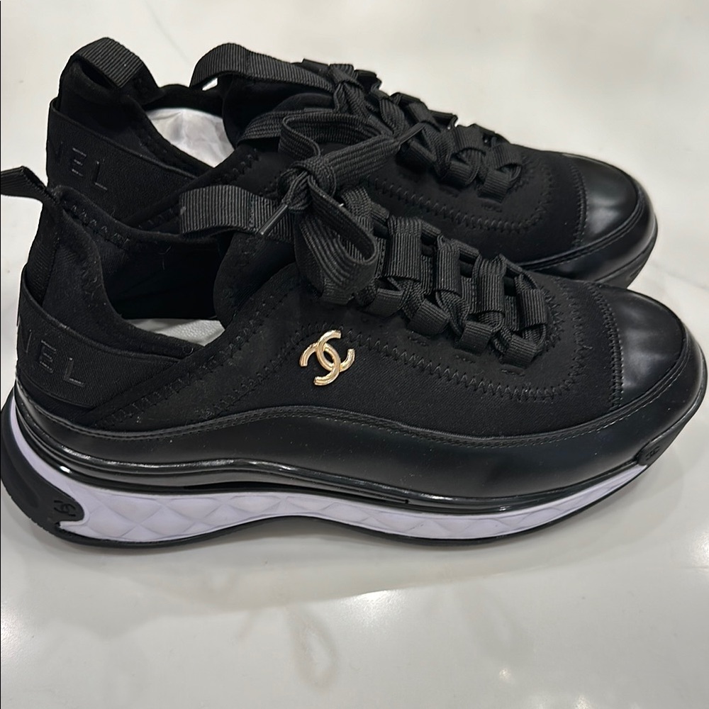 Black Sneakers with Gold Logo